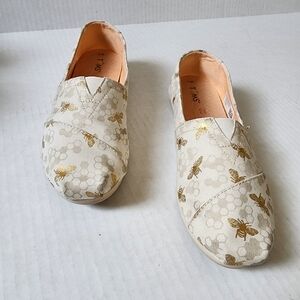 TOM'S Bee kind tan and gold canvas shoes
